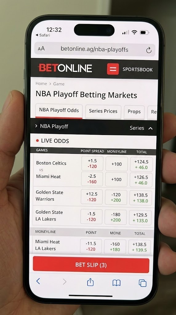 BetOnline Review 2026: A hand holding a smartphone displaying the BetOnline mobile sportsbook interface with live betting odds and point spreads for NBA Playoff games.