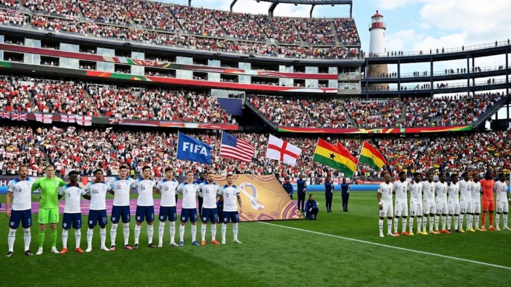 The national soccer squads line up on the pitch at Gillette Stadium ahead of kickoff for their competitive England vs Ghana World Cup group stage match.