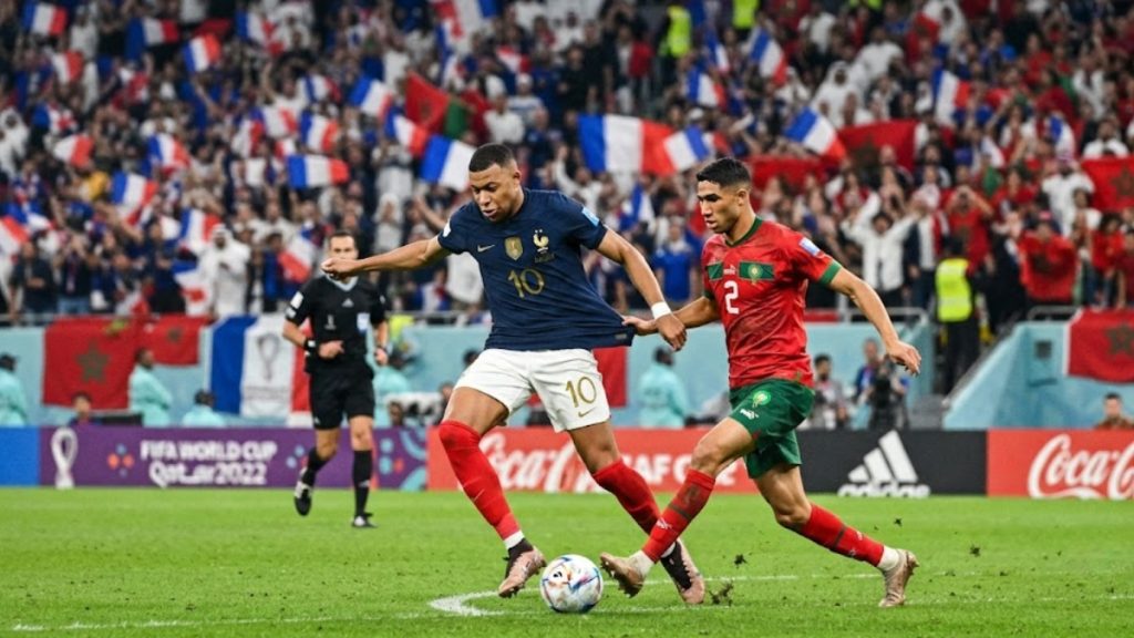 Quarterfinals World Cup intense duel between France and Morocco players during a tournament match.